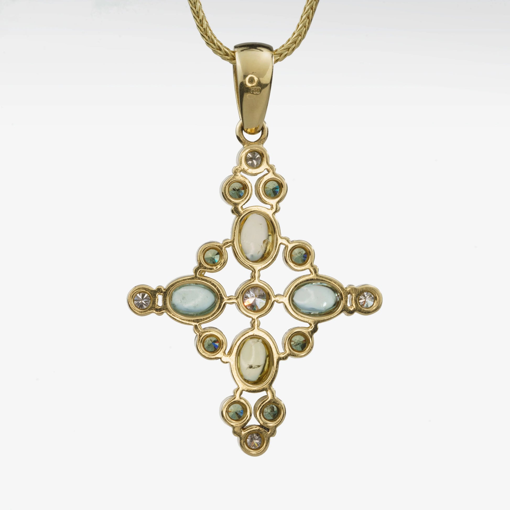 Kreuzanhänger 750 Gelbgold mit Beryllen, Aquamarinen und grünen Turmalinen